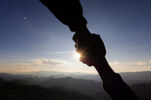 silhouette of helpping hand and hope concept and international day of peace.how can i help you