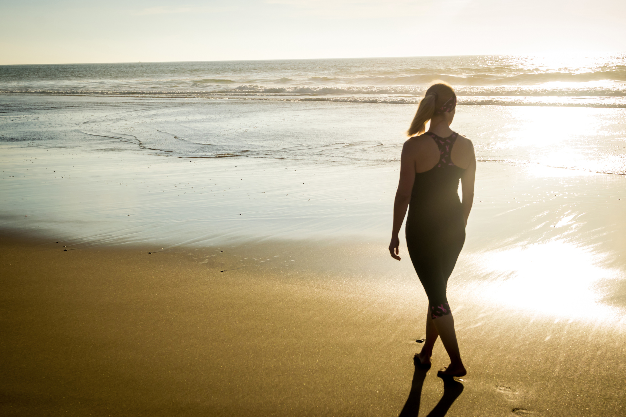 Woman exercising on the beach